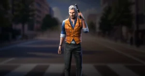 A joseph with gray hair and tattoos, wearing an orange vest and blue shirt, holds a handgun to his head while standing on street.